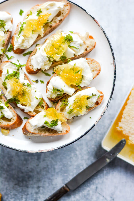 <p>Wanderings in My Kitchen</p><p>These addictive appetizers are made with toasted bread, creamy burrata and crystallized honeycomb – taken over the top with fresh mint, flaky sea salt, and orange zest!</p><p><strong>Get the recipe: <a href="https://wanderingsinmykitchen.com/honeyed-burrata-toasts/" rel="nofollow noopener" target="_blank" data-ylk="slk:Honeyed Burrata Toasts;elm:context_link;itc:0;sec:content-canvas" class="link rapid-noclick-resp"><em>Honeyed Burrata Toasts</em></a></strong></p>