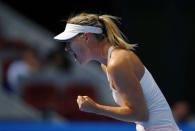 Maria Sharapova of Russia reacts after winning a game during her women's singles match against Elina Svitolina of Ukraine at the China Open tennis tournament in Beijing September 30, 2014. REUTERS/Petar Kujundzic