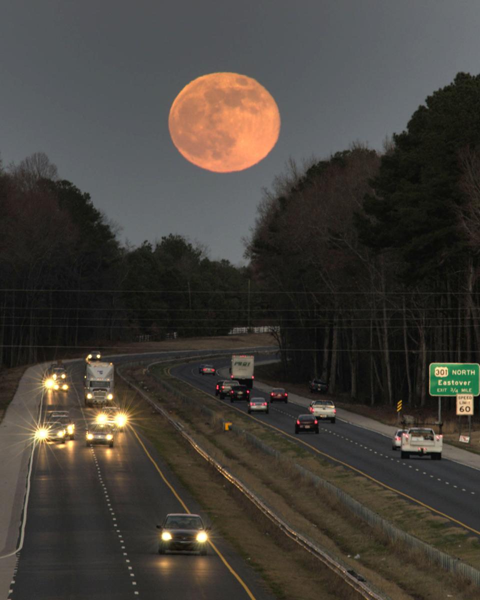 The full moon rises above U.S. 301 north of Fayetteville in this Dec. 12, 2008 photo taken from the Dobbin Holmes Road overpass. The December 2023 full moon is Dec. 26.