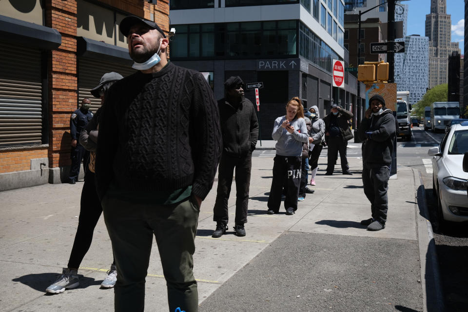 NEW YORK CITY- MAY 12: Hundreds of people wait in line for hours at a downtown Brooklyn office for their EBT Food Stamp cards on May 12, 2020 in New York City. Across America, people are reeling from the loss of jobs and incomes as unemployment soars to historical levels following the COVID-19 outbreak. While some states are beginning to re-open slowly, many business are struggling to find a profit with the new restrictions and a population that is fearful of the contagious virus.  (Photo by Spencer Platt/Getty Images)