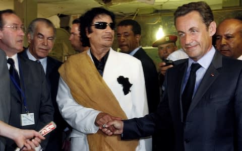 Libya's President Gaddafi greets his counterpart from France Sarkozy at Bab Azizia Palace in Tripoli, July 2007 - Credit:  Pascal Rossignol/Reuters