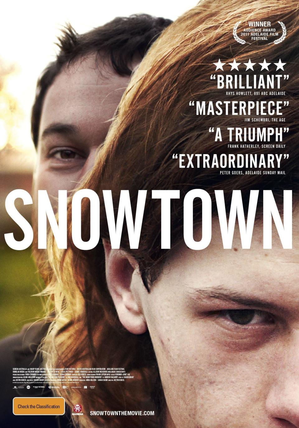 Poster image for the movie "Snowtown" depicting two boys staring at the camera; the one in the background is smiling, while the one in the foreground looks menacing