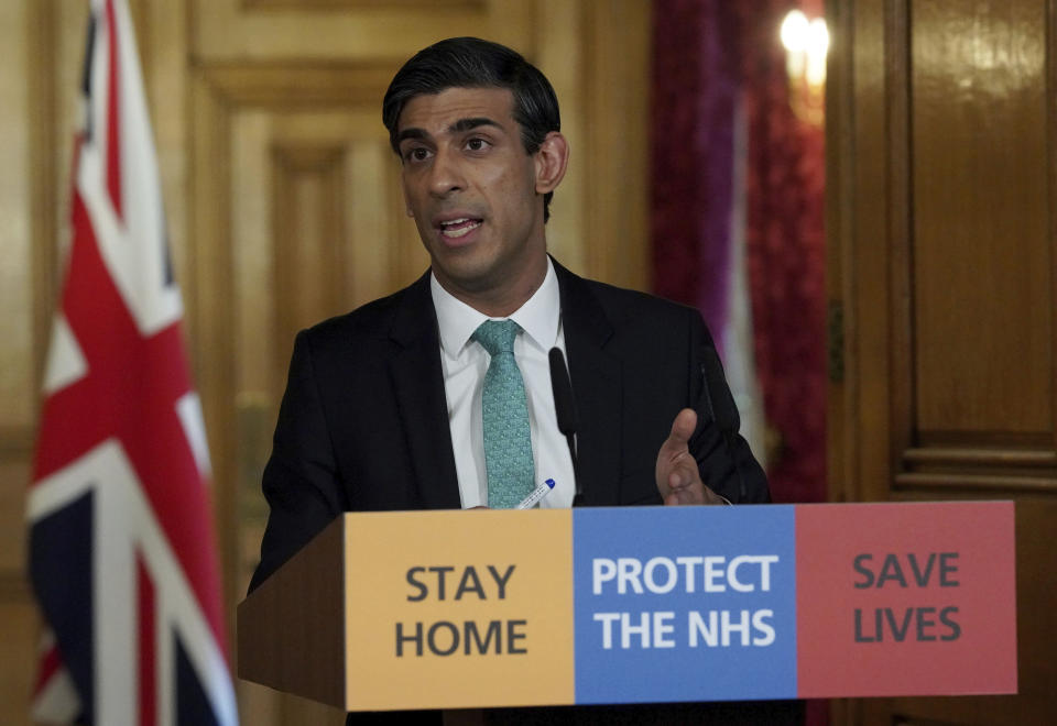 In this image made available by British government because no media allowed into 10 Downing Street because of the coronavirus pandemic, showing Chancellor of the Exchequer Rishi Sunak holding a digital press conference about the COVID-19 coronavirus, in 10 Downing Street, London, Thursday March 26, 2020.  Sunak on Thursday announced measures to give financial help to self-employed people. (Pippa Fowles/10 Downing Street via AP)