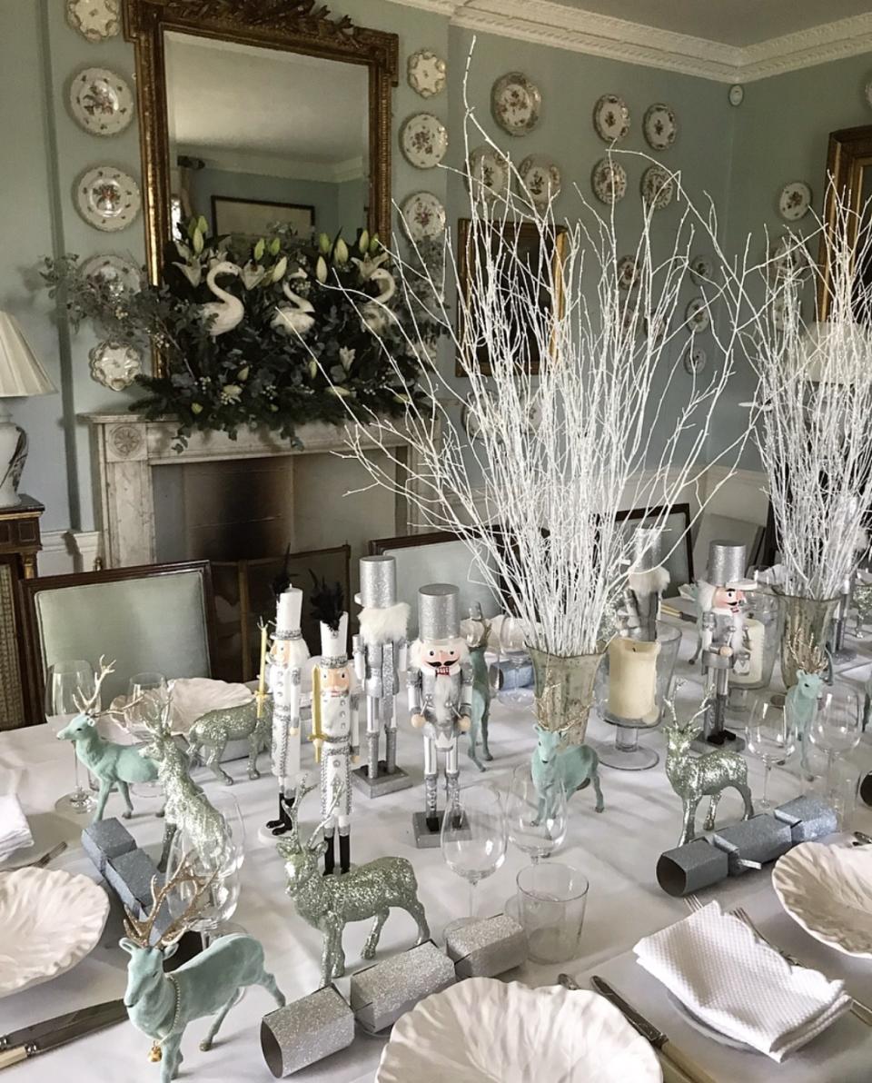 The table is laid for our Christmas Lunch: silver nutcrackers, glitter deer, and sparkly crackers aplenty.