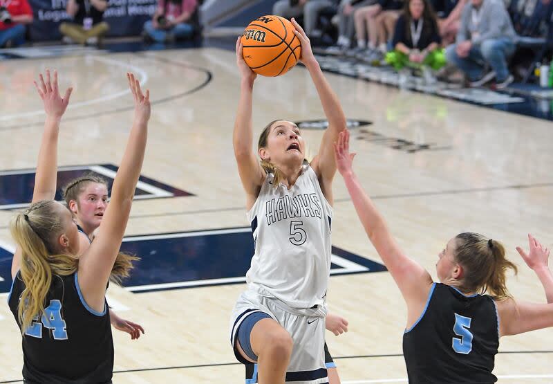 Ridgeline's Emilee Skinner (5) shoots the ball as Sky View's Kourtney Payne (24) and Hannah Radford (5) defend during the championship game of the Utah 4A girls basketball tournament on Saturday in Logan. | Eli Lucero, Herald Journal