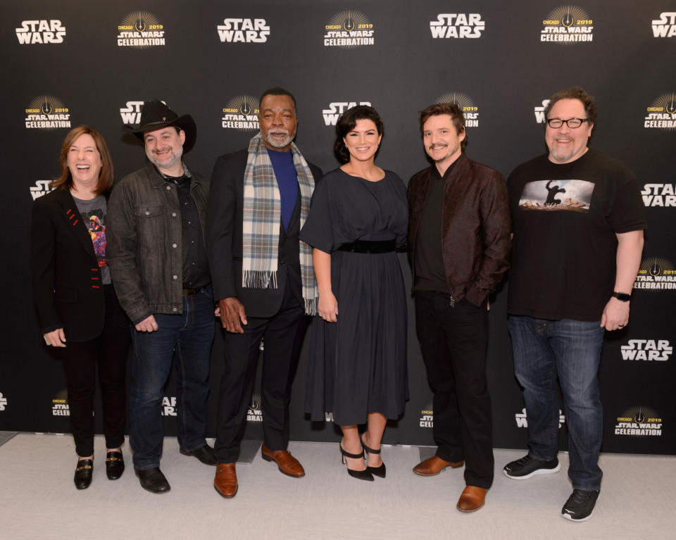 CHICAGO, IL - APRIL 14:  (L-R) Executive producer Kathleen Kennedy, Director/executive producer Dave Filoni, Carl Weathers (Greef), Gina Carano (Cara Dune), Pedro Pascal (The Mandalorian) and Director/executive producer Dave Filoni attend "The Mandalorian" panel at the Star Wars Celebration at McCormick Place Convention Center on April 14, 2019 in Chicago, Illinois.  (Photo by Daniel Boczarski/WireImage for Disney)