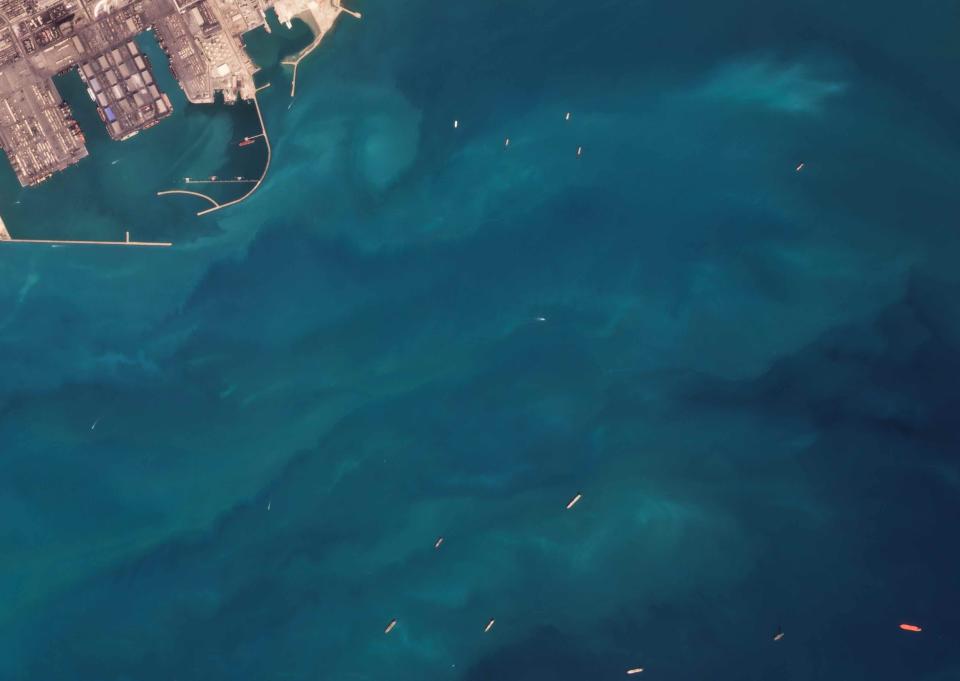 This satellite photograph from Planet Labs Inc. shows the Vietnamese-flagged oil tanker Sothys, the red vessel at the far bottom right, off the coast of Bandar Abbas, Iran, Saturday, Oct. 30, 2021. Iran seized a Vietnamese-flagged oil tanker in the Gulf of Oman last month and still holds the vessel, two U.S. officials told The Associated Press on Wednesday, Nov. 3, 2021, revealing the latest provocation in Mideast waters as tensions escalate between Iran and the United States over Tehran's nuclear program. (Planet Labs Inc. via AP)