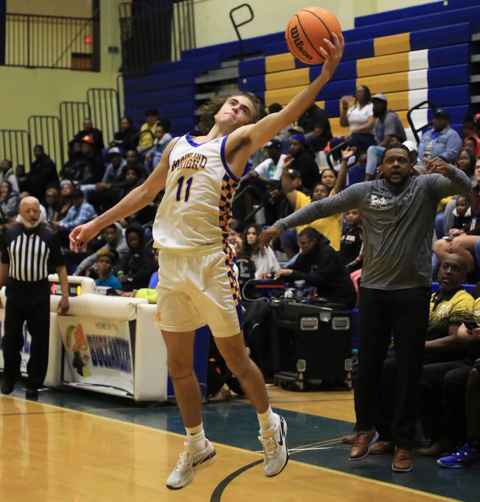 Mainland’s Kade Manley (11) catches a pass against Rickards in the Region 1-5A finals on Friday, Feb. 23, 2024 at Mainland High School.