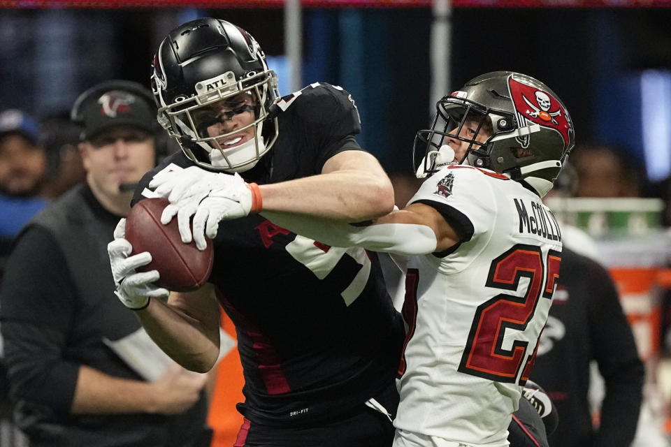 Atlanta Falcons wide receiver Drake London (5) makes a catch against Tampa Bay Buccaneers cornerback Zyon McCollum (27) during the second half of an NFL football game, Sunday, Jan. 8, 2023, in Atlanta. (AP Photo/John Bazemore)