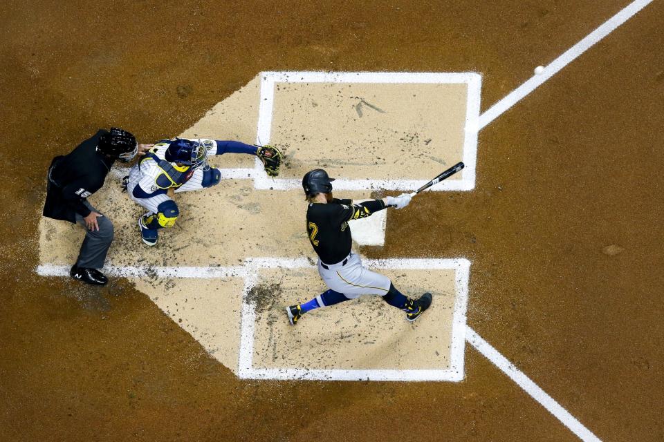 Pittsburgh Pirates' Colin Moran hits a home run during the second inning of a baseball game against the Milwaukee Brewers Friday, April 16, 2021, in Milwaukee. (AP Photo/Morry Gash)