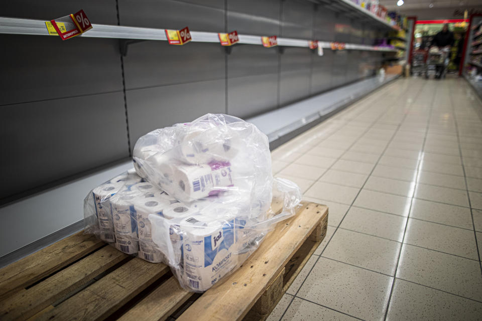 NIESKY, GERMANY - MARCH 13: Packages of toilet paper are pictured in front of an empty shelf in a supermarket on March 13, 2020 in Niesky, Germany. Many people are about to do panic buying because of the spread of corona virus. (Photo by Florian Gaertner/Photothek via Getty Images)