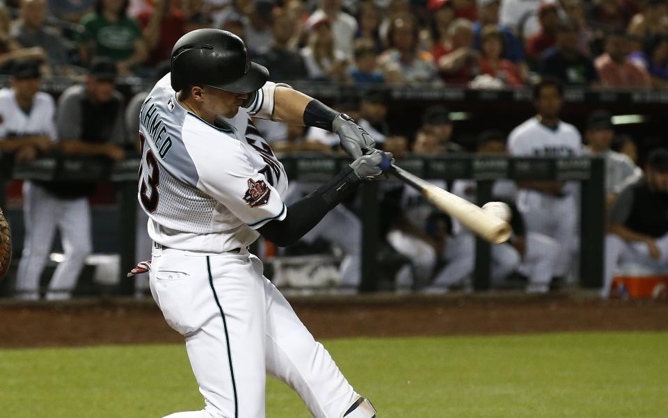 Arizona Diamondbacks' Nick Ahmed connects for a three-run double against the Atlanta Braves during the fourth inning of a baseball game Thursday, Sept. 6, 2018, in Phoenix. (AP Photo/Ross D. Franklin)