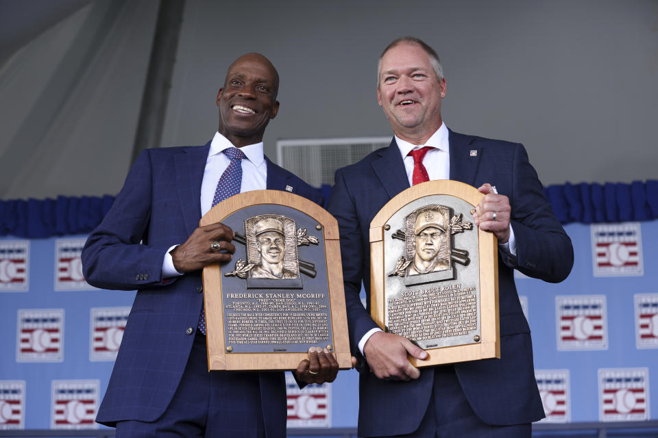 Hall of Fame inductees Fred McGriff, left, and Scott Rolen, right, pose for a picture during the National Baseball Hall of Fame induction ceremony, Sunday, July 23, 2023, at the Clark Sports Center in Cooperstown, N.Y. (AP Photo/Bryan Bennett)