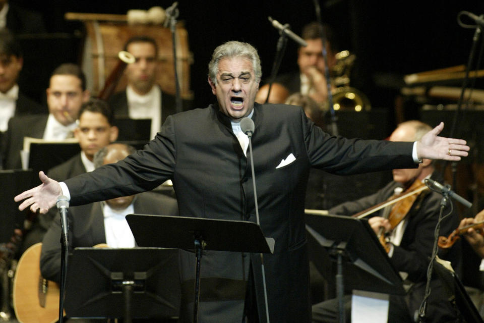 FILE - In this Thursday, Jan. 22, 2004, file photo, Placido Domingo sings during his performance at the National Theater in Santiago, Dominican Republic. Nine women in the opera world have told The Associated Press that Domingo, one of the most celebrated and powerful men in the industry, tried to pressure them into sexual relationships and sometimes punished women professionally when they refused his advances. (AP Photo/Miguel Gomez, File)