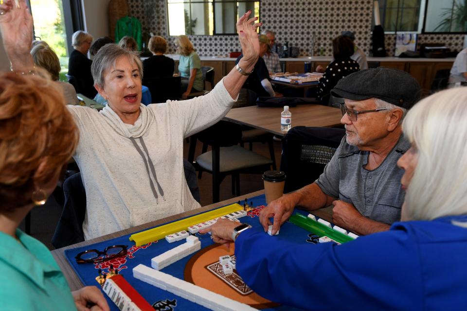 Andrea Goldstein reacts after she wins a mahjong hand at the Grove retirement community in Camarillo on a recent Thursday.