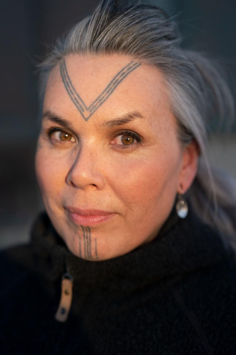 Maya Sialuk Jacobsen, a tattoo artist who's helping revive traditional Inuit culture, in part by popularizing face tattoos like her own, which mimics a design discovered on 500-year-old female Inuit mummies.