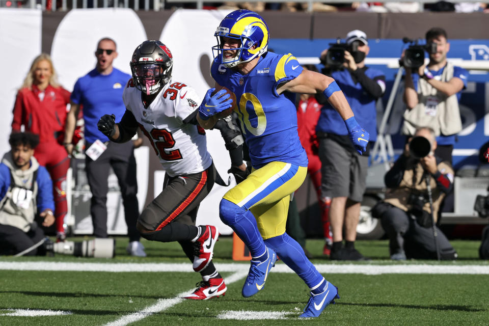 Los Angeles Rams wide receiver Cooper Kupp (10) beats Tampa Bay Buccaneers safety Mike Edwards (32) on a 70-yard touchdown reception during the first half of an NFL divisional round playoff football game Sunday, Jan. 23, 2022, in Tampa, Fla. (AP Photo/Mark LoMoglio)