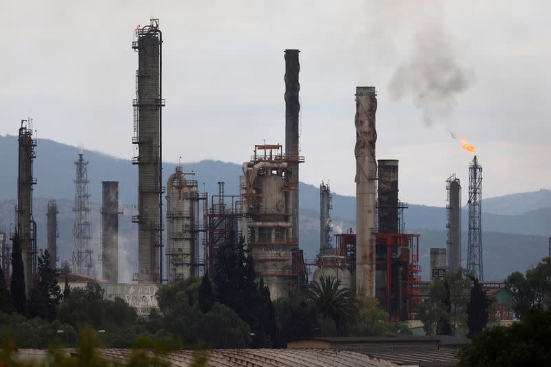 FILE PHOTO: Excess natural gas is burnt, or flared, from Mexican state-owned Pemex's Tula oil refinery, located adjacent to the Tula power plant belonging to national power company Comision Federal de Electricidad, or CFE, in Tula de Allende