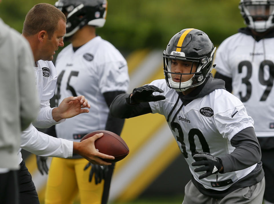 James Conner has seen pressure on and off the field in his life and says he’s not fazed by the spotlight thrust upon him in Le’Veon Bell’s absence. (AP)