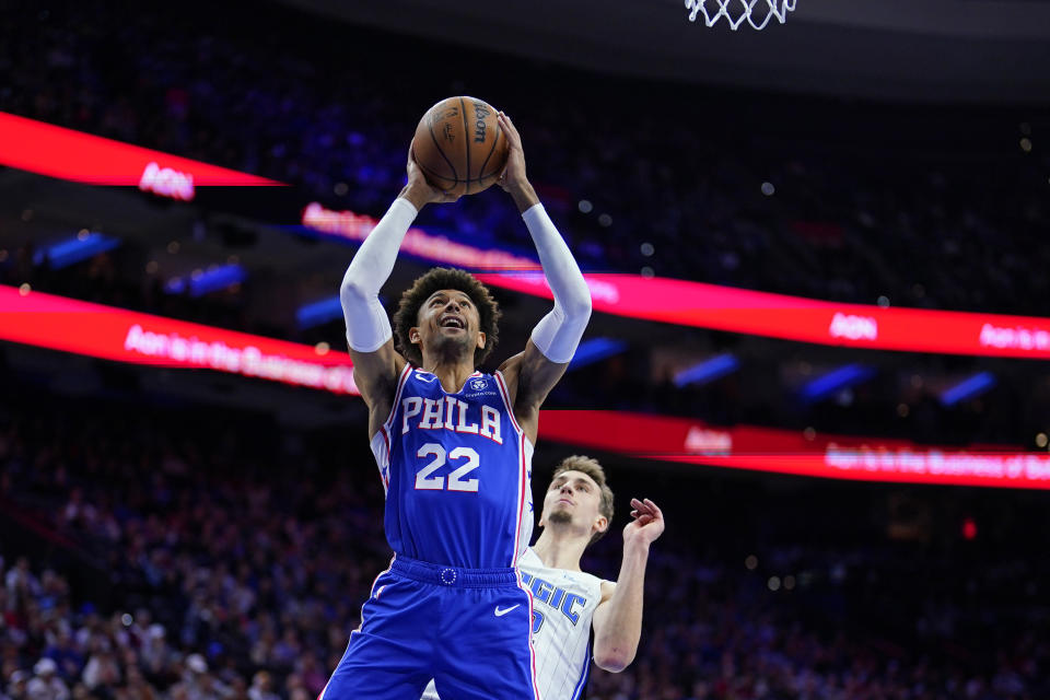 Philadelphia 76ers' Matisse Thybulle, left, goes up for a shot against Orlando Magic's Franz Wagner during the first half of an NBA basketball game, Wednesday, Feb. 1, 2023, in Philadelphia. (AP Photo/Matt Slocum)