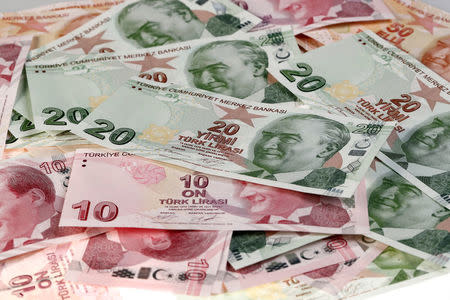 FILE PHOTO: Turkish Lira banknotes are seen in this October 10, 2017 picture illustration. REUTERS/Murad Sezer/Illustration/File Photo