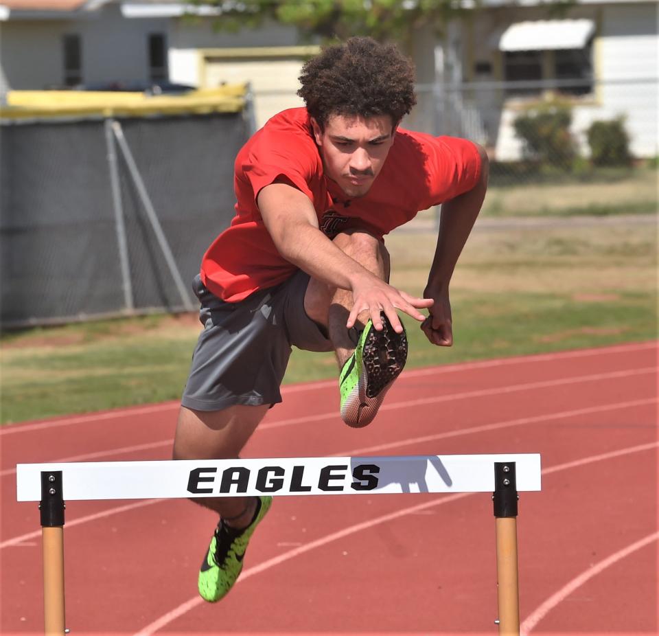 Abilene High's Noah Hatcher clears a hurdle during practice Tuesday at Abilene High. Hatcher will compete in the 110- and 300-meter hurdles at the Region I-6A meet Friday at Maverick Stadium in Arlington.