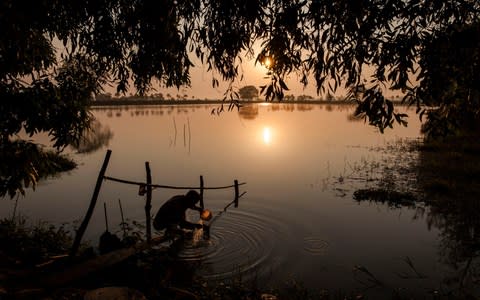 Sun rises over the Ayeyarwady region where many farmers have had their land confiscated - Credit: Patrick Brown/Human Rights Watch