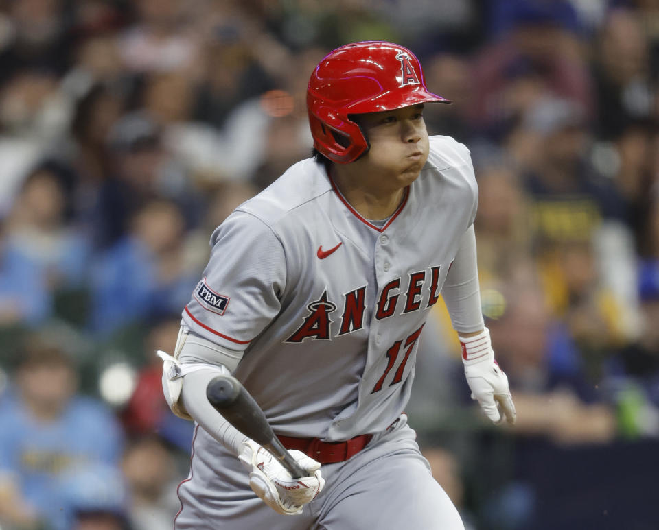 Los Angeles Angels designated hitter Shohei Ohtani heads toward first after hitting into a fielder's choice against the Milwaukee Brewers during the first inning of a baseball game Friday, April 28, 2023, in Milwaukee. (AP Photo/Jeffrey Phelps)