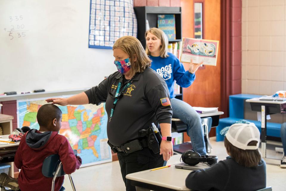 School Resource Officer Deputy Angela Young walks around a fifth grade class at Pine Level Elementary on March 4, 2021.