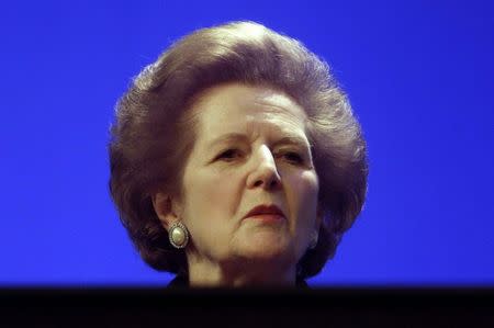 Former British Conservative Prime Minister Margaret Thatcher sits on the platform at the party's annual conference, in this October 6, 1999 file photo. REUTERS/Files