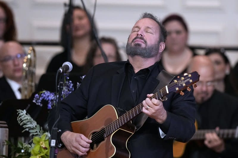 Garth Brooks performs "Imagine" at a tribute service for former first lady Rosalynn Carter at Glenn Memorial Church at Emory University on November 28 in Atlanta. Pool Photo by Brynn Anderson/UPI