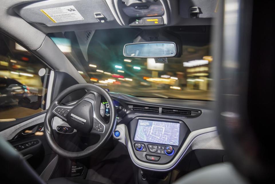 An autonomous Cruise taxi drives through a turn in downtown Austin on Sept. 26, 2023. Cruise, a San Francisco-based autonomous car company, is one of several autonomous driving companies that test vehicles in Austin.