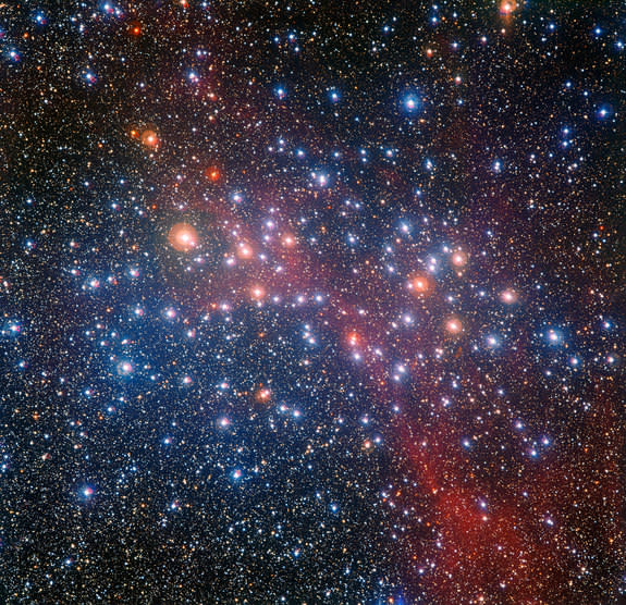 Bright star cluster NGC 3532 contains stars of bluish color and also red giants glowing with an orange hue. Image released Nov. 26, 2014.