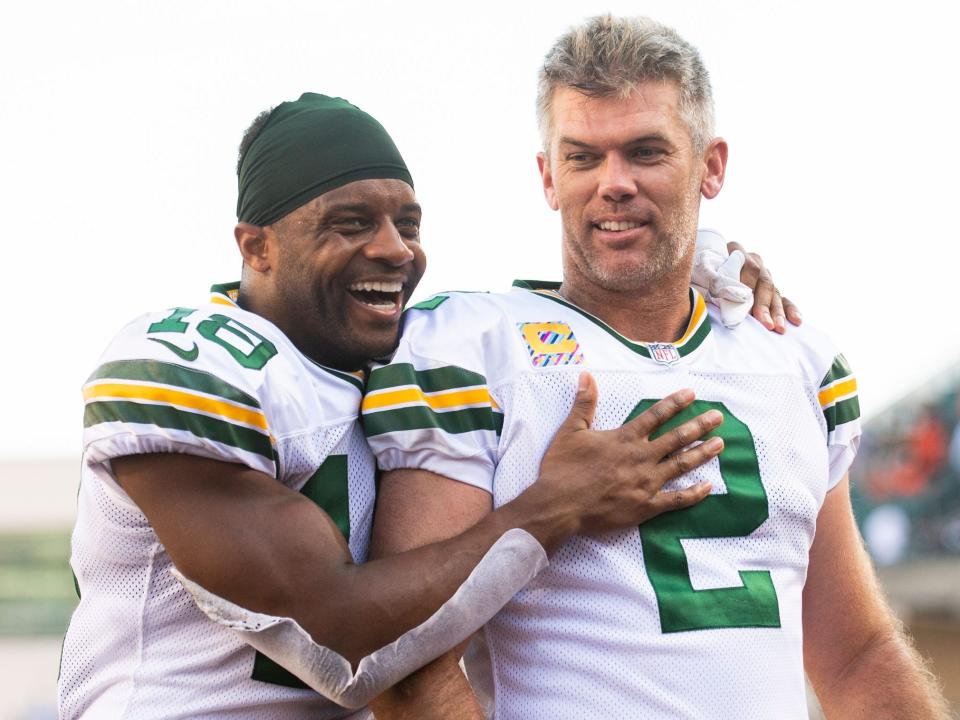 Mason Crosby celebrates with Randall Cobb after kicking a game-winning field goal against the Cincinnati Bengals.