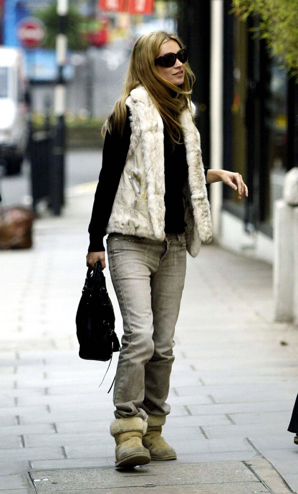 Kate Moss wears UGG shoes in London, England, on December 16, 2003.