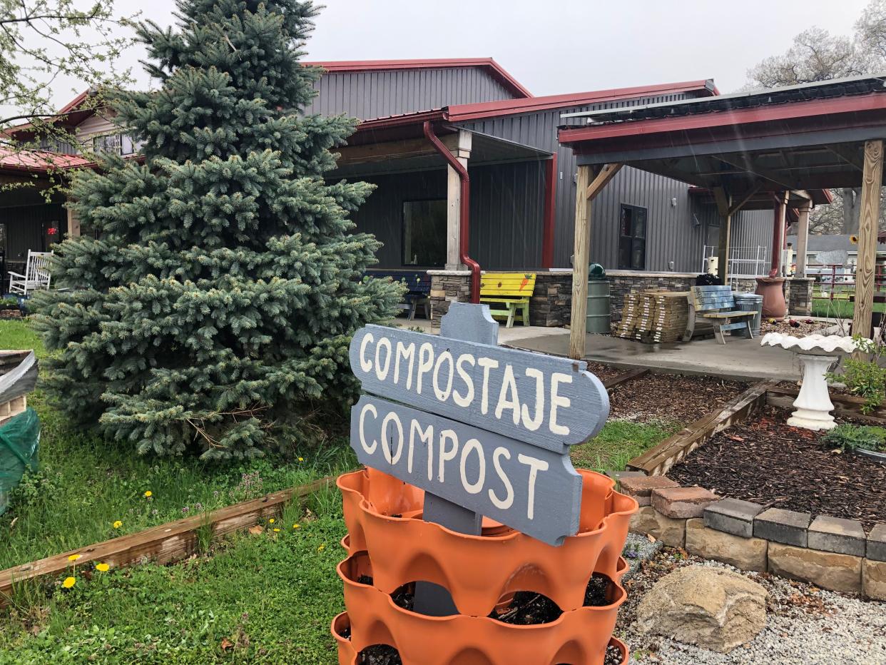 Compost containers, labeled in English and Spanish, are found at Unity Gardens in South Bend, which will host an Earth Day celebration on April 20, 2024.