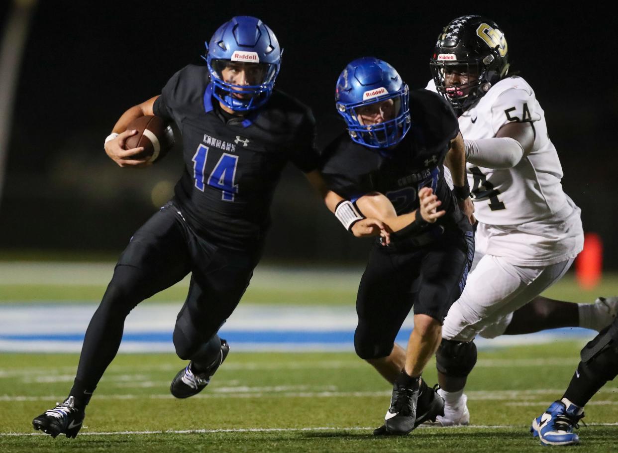 The Golden Gate Titans compete against the Barron Collier Cougars in a district game at Barron Collier High School in Naples on Friday, Oct. 13, 2023.