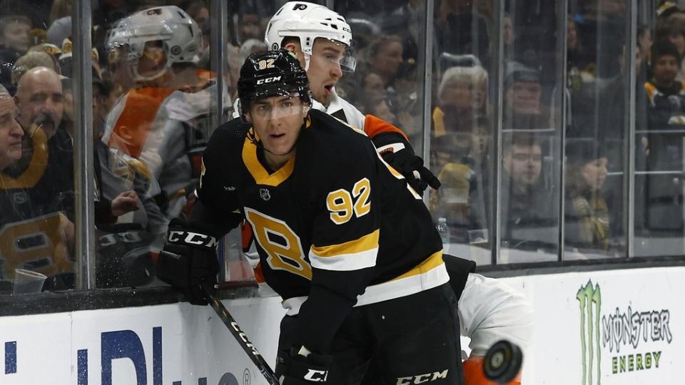 Then Boston Bruins left wing Tomas Nosek (92) keeps his eye on the puck as he checks Philadelphia Flyers defenseman Rasmus Ristolainen (55).