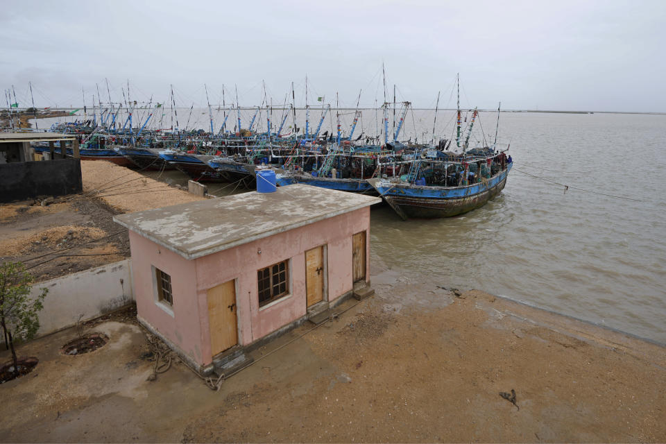 Fishing boats are anchored following authorities alerting of Cyclone Biparjoy approaching, at a costal area of Keti Bandar near Thatta, Pakistan's southern district in the Sindh province, Wednesday, June 14, 2023. The coastal regions of India and Pakistan were on high alert Wednesday with tens of thousands being evacuated a day before Cyclone Biparjoy was expected to make landfall. (AP Photo/Fareed Khan)