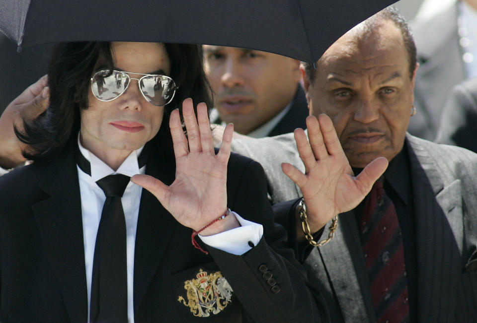 Michael Jackson and father Joe leave the Santa Barbara County courts after Michael was acquitted on all 10 charges in his child molestation trial in 2005. (Photo: Kimberly White via Getty Images)