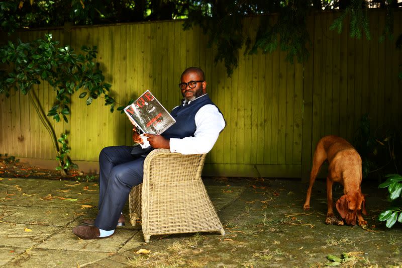 Photographer and founder of What We Seee Harriman, sits in his garden in Woking