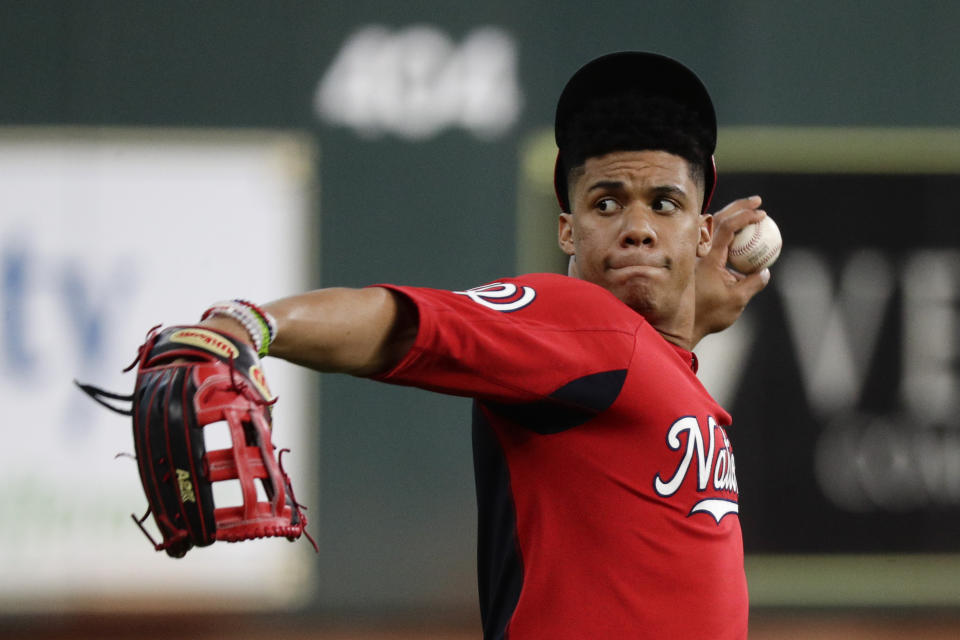 Washington Nationals left fielder Juan Soto warms up during batting practice for baseball's World Series Monday, Oct. 21, 2019, in Houston. The Houston Astros face the Washington Nationals in Game 1 on Tuesday. (AP Photo/Eric Gay)