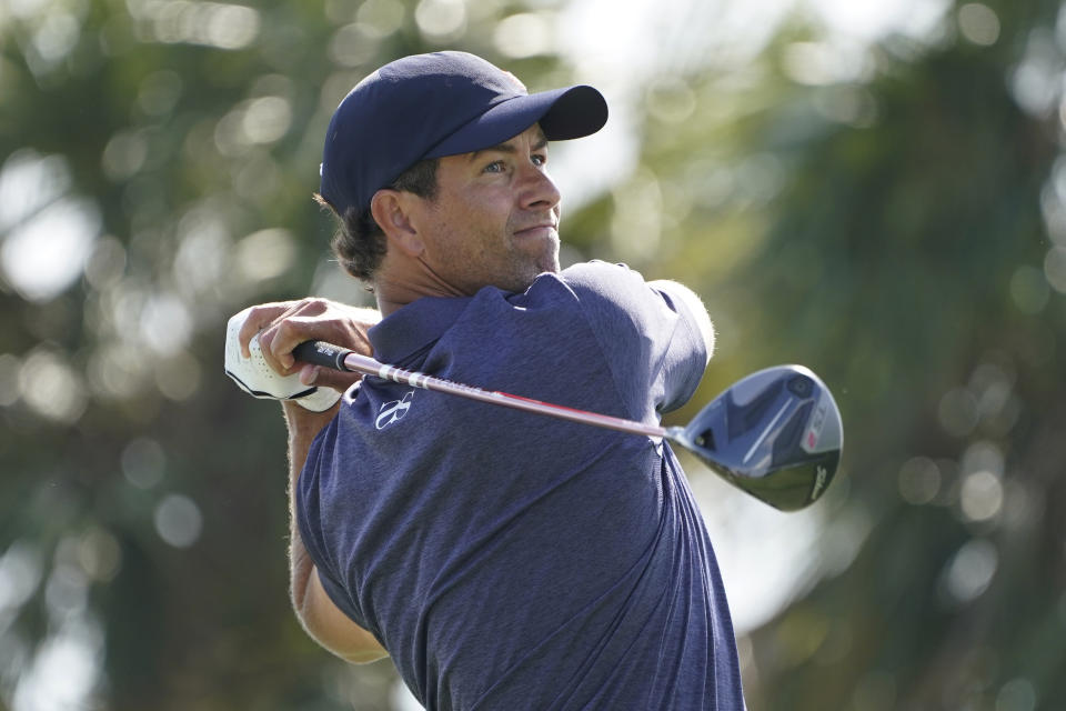 Adam Scott of Australia hits from fourth tee during the first round of the Honda Classic golf tournament, Thursday, March 18, 2021, in Palm Beach Gardens, Fla. (AP Photo/Marta Lavandier)