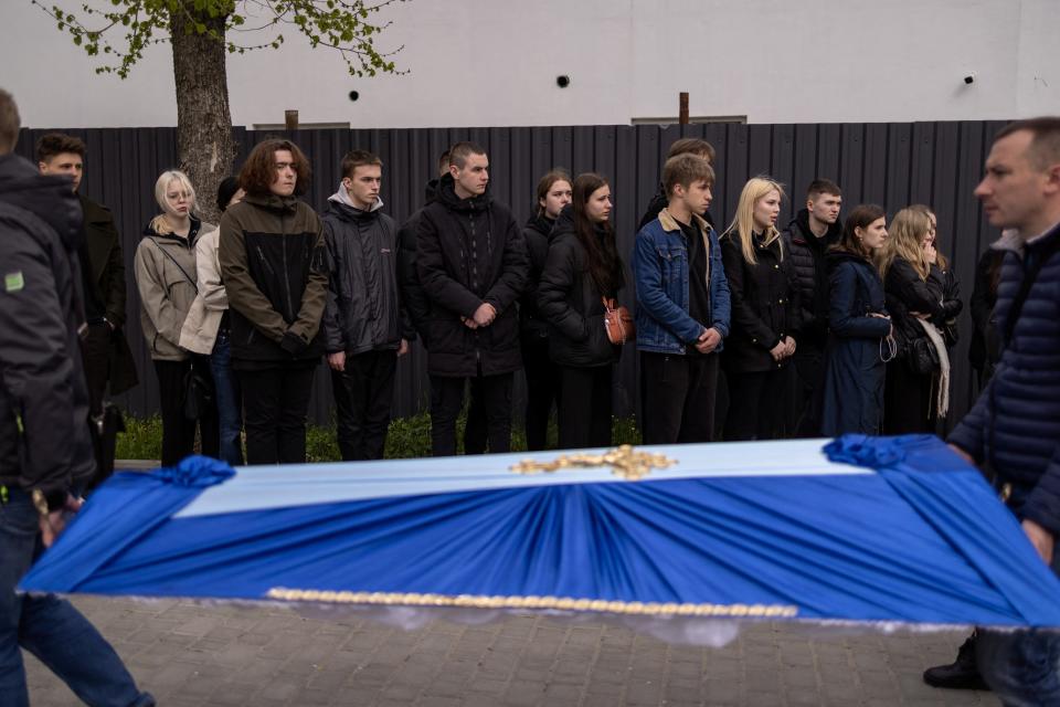 People react during the funeral of two children, Sofia and Kyrylo, who officials said were killed on Friday by a Russian missile strike (REUTERS)