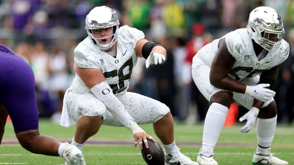 <div>SEATTLE, WASHINGTON - OCTOBER 14: Jackson Powers-Johnson #58 of the Oregon Ducks prepares for a snap against the Washington Huskies at Husky Stadium on October 14, 2023 in Seattle, Washington. (Photo by Steph Chambers/Getty Images)</div>