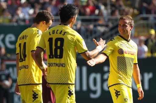 Dortmund's Lucas Barrios (C) celebrates with teammates after scoring a goal during their German first division Bundesliga match against Kaiserslautern, in Kaiserslautern, on April 28. Dortmund will be waving goodbye to Barrios who has signed a deal with Chinese club Guangzhou for next season