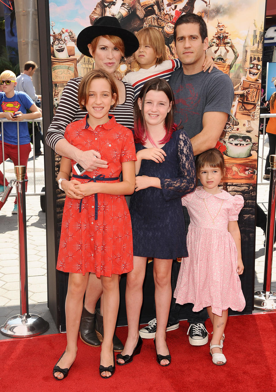 Molly Ringwald poses with husband Panio Gianopoulos and children at 