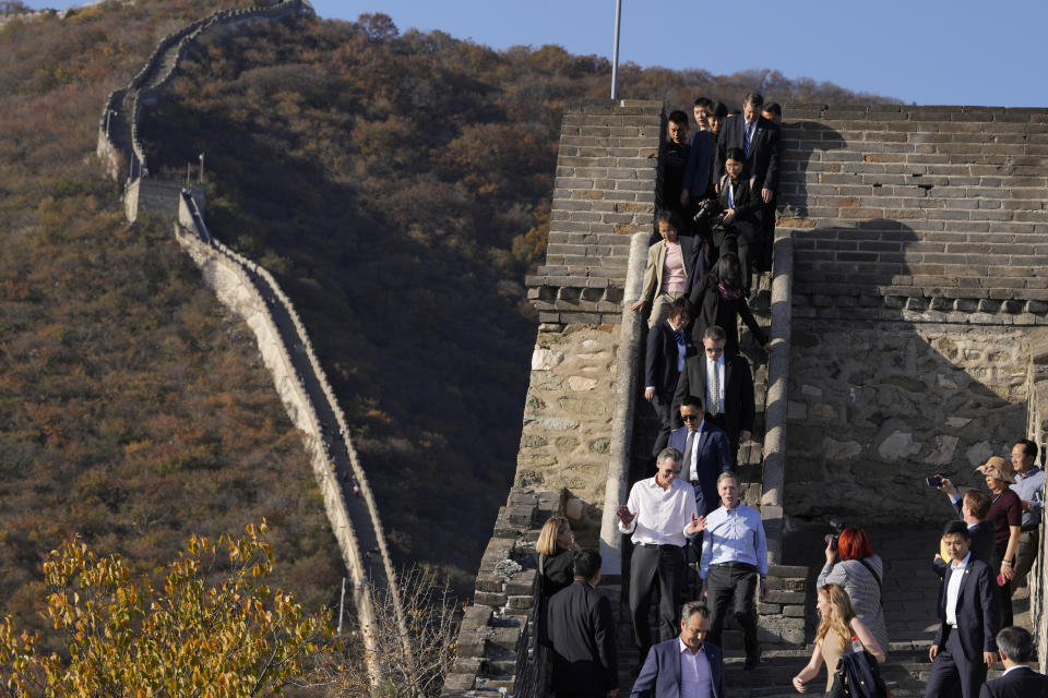 California Gov. Gavin Newsom, in white shirt at left, chats with U.S. ambassador to China Nicholas Burns, as they visit the Mutianyu Great Wall on the outskirts of Beijing, Thursday, Oct. 26, 2023. Newsom is on a weeklong tour of China where he is pushing for climate cooperation. His trip as governor, once considered routine, is drawing attention as it comes after years of heightening tensions between the U.S. and China. (AP Photo/Ng Han Guan)