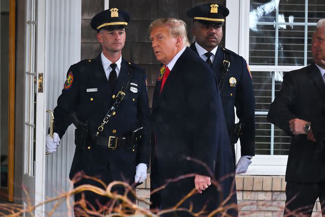 <p>Angela WEISS / AFP via Getty</p> Donald Trump arrives for the wake of slain NYPD Officer Jonathan Diller in Massapequa, New York, on March 28, 2024