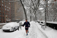 <p>A man jogs in the snow on a sidewalk along Central Park West in New York, Feb. 9, 2017. (Photo: Mike Segar/Reuters) </p>